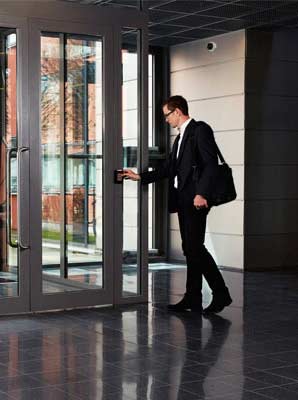 Image of Man exitiing Office Building